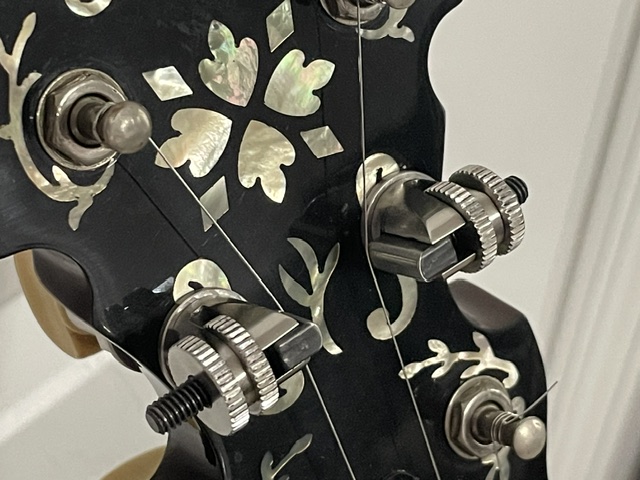 American-made banjo cam tuners in nickel and gold finishes